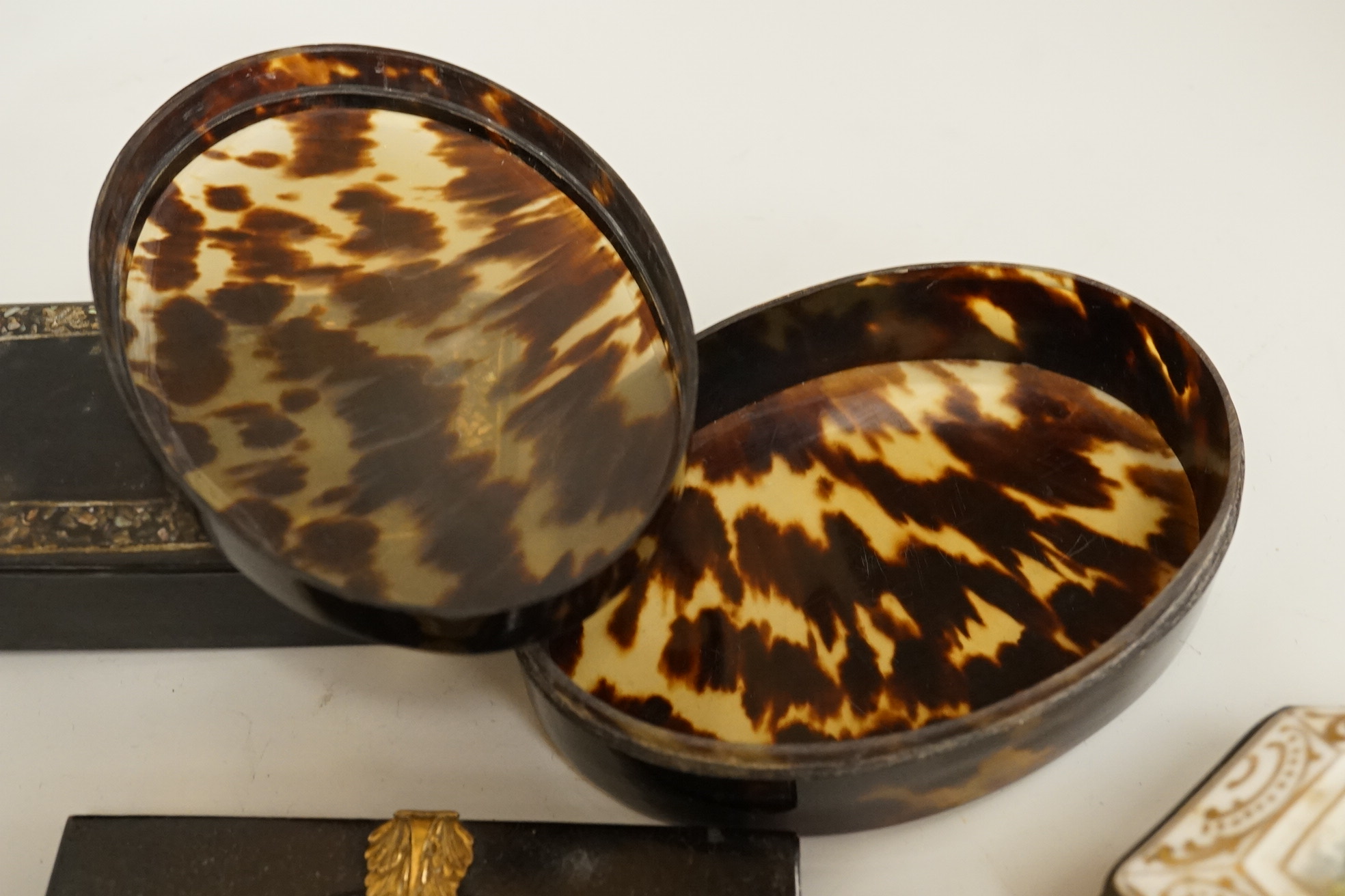 A collection of 19th century and later snuff and pill boxes, a silhouette frame and a gilt metal frame